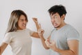 Funny angry face couple mad and fight at each other isolated on white. Royalty Free Stock Photo