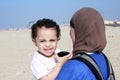 Funny arab muslim egyptian baby girl with her mother Royalty Free Stock Photo