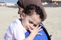 Funny arab muslim egyptian baby girl with her mother Royalty Free Stock Photo