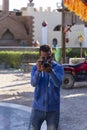 Funny Arab photographer. Photographing tourists during a Safari in the Sahara desert