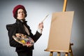 Funny artist in dark studio Royalty Free Stock Photo