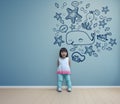 Funny asian child playing in blue room at home