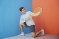 Funny asian guy holding tennis racket Royalty Free Stock Photo