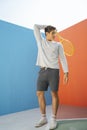 Funny asian guy holding tennis racket Royalty Free Stock Photo