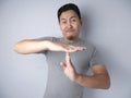 Funny Asian Man Making Time Out Gesture Royalty Free Stock Photo