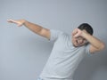 Funny Asian Man Smiling and Making Dab Movement Royalty Free Stock Photo