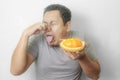 Funny Asian Man With Stinky Durian Fruit Royalty Free Stock Photo