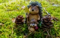 Funny Hedgehogs with Pine cones on green Moss