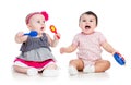 Funny babies girls play musical toys Royalty Free Stock Photo