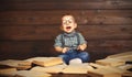 Funny baby with books in glasses Royalty Free Stock Photo