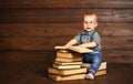 Funny baby with books in glasses Royalty Free Stock Photo