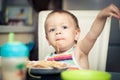 Funny baby boy eating spaghetti Royalty Free Stock Photo