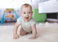 Funny baby crawling on floor at home Royalty Free Stock Photo