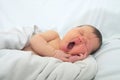 Funny baby face,newborn with jaundice on white blanket, infant healthcare Royalty Free Stock Photo