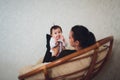 Funny baby girl with mother at home. Royalty Free Stock Photo