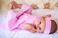 Funny baby girl in a pink dress Royalty Free Stock Photo