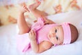 Funny baby girl in a pink dress Royalty Free Stock Photo