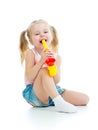 Child girl playing with musical toy Royalty Free Stock Photo