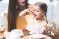 Child girl with mother in cafe Royalty Free Stock Photo