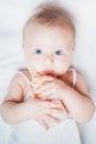 Funny baby holding a bottle with mothers breast milk Royalty Free Stock Photo
