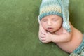 Funny baby in knitted hat sleeping with opened mouth Royalty Free Stock Photo