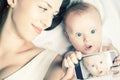 Funny baby and mother make selfie on mobile phone Royalty Free Stock Photo