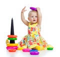 Funny baby playing with color developmental toy Royalty Free Stock Photo