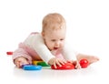 Funny baby playing with toys isolated ober white background