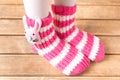 Funny baby socks on the background of wooden table