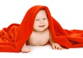 Funny baby under the red towel Royalty Free Stock Photo