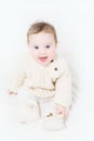 Funny baby in a warm cable knit sweater and boots Royalty Free Stock Photo