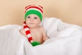 Funny baby is wearing an elf or dwarf hat. Adorable little boy Royalty Free Stock Photo