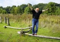 Funny balancing senior man on fitness track Royalty Free Stock Photo