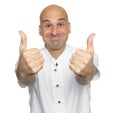 Funny bald man showing his thumbs up. Isolated Royalty Free Stock Photo