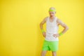 Funny bald man in a sports uniform on a yellow background. retro style Royalty Free Stock Photo