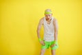 Funny bald man in a sports uniform on a yellow background. retro style Royalty Free Stock Photo