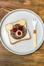 Funny bear face sandwich toast bread with peanut butter, cheese and raspberry on plate wooden background. Kids child sweet dessert Royalty Free Stock Photo