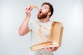Funny bearded hungry man eating pizza