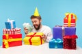 Funny Bearded Man Boss In Party Cap Holding Lot Of Euro Cash And Opened Gift Box, Preparing Many Money Presents For His Employees