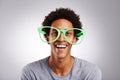 Funny, big glasses and black man with a smile, happy and funky eyewear on a white studio background. Portrait, trendy Royalty Free Stock Photo