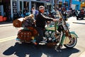 Funny biker in Daytona bike week Florida with the dog in the main street