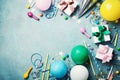 Funny birthday party background. Colorful balloon, gift box, confetti, candy and streamer on turquoise table top view. Flat lay.