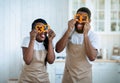 Funny Black Couple Fooling In Kitchen While Cooking Dinner Together Royalty Free Stock Photo