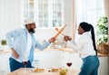 Funny Black Couple Having Fun In Kitchen, Using Kitchenware For Play Fight Royalty Free Stock Photo