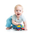 Funny boy baby playing with toy car Royalty Free Stock Photo