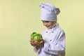 Chef keeps in his hands a cabbage Royalty Free Stock Photo