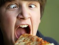 Funny Boy Eating Pizza Royalty Free Stock Photo