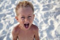 Funny boy has fun on the sea Royalty Free Stock Photo