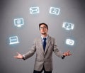 Funny boy juggling with electronic devices icons Royalty Free Stock Photo