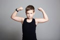 Funny Boy. Little bodybuilder showing his hand biceps muscles Royalty Free Stock Photo